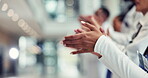 Success, hands and applause with doctors in hospital for celebration, support and healthcare. Teamwork, medical and cheering with closeup of people in clinic for achievement, winner and solidarity