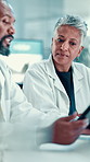People, scientist and discussion with tablet at laboratory for medical research or results. Man, woman or employees with technology for science breakthrough, exam or test data together at clinic