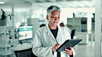 Laboratory, woman and scientist with tablet for report, investigate and scroll research for medical. Healthcare, mature person and doctor with tech for online study, information and results for test