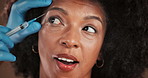 Eye brow, face and filler with black woman in studio for antiaging treatment or plastic surgery. Beauty, hands of surgeon and needle with African person in clinic for cosmetic procedure or injection
