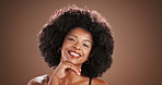Face, skincare and happy African woman with glow in studio, beauty and dermatology. Portrait, smile and model with facial cosmetics, makeup and confident with afro hairstyle on background with space