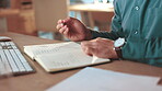 Writing, notebook and business person with pen for information, research and website. Night, ideas and man with tech working on project schedule, problem solving and brainstorming review in office