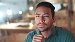 Typing, thinking and businessman with computer for information, research and website. Night reading, ideas and male person with tech working on project, problem solving and brainstorming in office