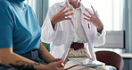 Tablet, doctor and hands with people in office for healthcare advice, patient history and checkup. Digital records, medical diagnosis and help with person in clinic for symptoms survey and talk