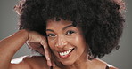 Face, beauty and black woman in studio, makeup and dermatology on grey background. African person, grooming and happy model with wellness, afro and skincare with shine, aesthetic and cosmetics