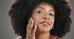 Face, beauty and black woman in studio, shine and skincare with makeup on grey background. African person, space and happy model with wellness, afro and cosmetics with glow and texture with aesthetic