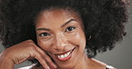 Face, beauty and black woman in studio, smile and dermatology on grey background. African person, space and happy model with makeup, afro and skincare with shine, glow and confidence with aesthetic