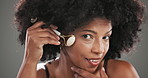 Skincare, facial roller and face of black woman in studio for natural, beauty or lymphatic drainage. Dermatology, portrait and person with cosmetic tool for blood circulation by gray background.