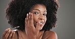 African woman, face and skincare with serum for wellness, natural cosmetics and model with afro. Portrait, female person and anti aging with oil dropper for beauty, dermatology and studio background