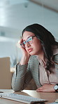 Tired, bored and business woman with burnout, overwork and low energy with computer at night. Thinking, fatigue or lazy worker with stress for deadline, exhausted or challenge on overtime in office