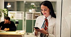 Business, woman and typing with phone in office at night for networking, text message and work break. Overtime, employee or happy with smartphone for professional chat, online advice or communication