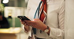 Hands, phone and texting at startup, contact and night at office for networking, deal and chat. Person, smartphone and communication with mobile app, scroll and check notification at creative agency