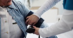 Hands, old person or nurse with blood pressure in clinic for medical checkup, heart rate or test. Consultation, senior patient and cardiovascular machine for hypertension exam and wellness assessment