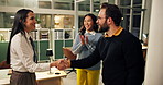 Happy, business people and night with applause or handshake for deal, agreement or introduction. Group, employee or colleagues shaking hands with smile in late evening for b2b or partnership together