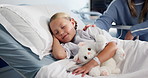 Girl, sick and mother in hospital, kid and comfort with illness, single parent and healthcare. Family, patient and child with mama, bear or support with wellness, pediatrics or diagnosis with results