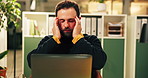 Frustrated, businessman and night with headache on laptop for eye strain or overworked at office. Man, employee or administrator working late with stress, migraine or fatigue for pressure or deadline