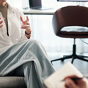 Patient, hands and therapist in counseling for mental health ...