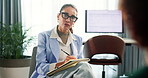 Psychologist, woman and notes in consultation for mental health, discussion and recovery support for anxiety. Patient, therapist writing and person with counseling, trauma and conversation in session