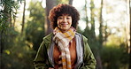 Face, hiker and woman with smile in woods, calm and fresh air for traveller on holiday or adventure. Outdoor, happy and person on hike in forest, wellness and confident on break, trip and vacation
