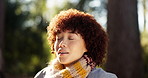Breathing, fresh air and woman in woods, calm or wellness for traveller in nature, happy or holiday. Outdoor, hiker and person with smile on break, peace and confident on vacation in forest and trip