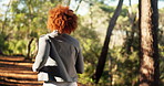Running, fitness and woman in forest, back and health with cardio, hobby and energy. Person, outdoor and runner in woods, exercise and workout with training, endurance and challenge with wellness