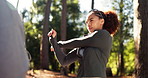 Stretching, fitness and woman in forest, exercise and nature with holiday, training and warm up. Outdoor, person and runner in woods, practice and wellness with environment, healthy and challenge