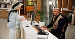 People, hotel concierge and talking with customer for accommodation or hospitality at front desk. Man, woman and discussion with manager for complaint, enquiry or question at luxury resort or lodge