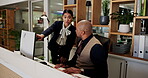Hotel manager, team and advice to employee, computer and explaining policy on web and communication. Motel, receptionist and talking to mentor with tech, people and collaboration for hospitality