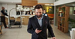 Hotel, businessman and luggage with smartphone for travel, professional communication and check in. Walking, person and guest with mobile for online booking, accommodation and arriving with suitcase