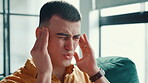 Man, stress and migraine in home with massage, tension and rub temples for relief. Person, cluster headache and burnout in living room with vertigo, medical emergency and symptom of dehydration