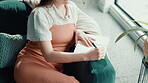 Relax, notebook and writing with woman on sofa for inspiration, journal prompt and reminder. Reflection, agenda and planning with person in living room of home for diary, checklist and brainstorming