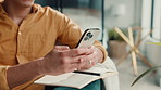 Notebook, phone and hands of person in home for planning, digital notes and agenda. Living room, typing and man with smartphone on website with planner for schedule, reminder and checklist for tasks
