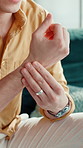 Man, hands or wrist pain with injury for carpal tunnel syndrome or inflammation on sofa at home. Closeup, male person or sore arm with joint ache or arthrits for overworked or muscle tension at house