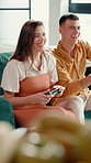 Playing, video game and fun for couple, living room and cheating on virtual sport, home or together. Happy, man and woman with controller for entertainment, gamer or challenge for digital competition