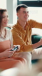 Living room, video game and fun for couple, together and cheating on virtual sport, playing or home. Happy, man and woman with controller for entertainment, gamer or challenge for digital competition