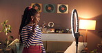 Live streaming, ring light and wave with black woman in home for influencer, promotion or smile. Social media content creator and recording with person and phone for vlog broadcast or follower advice