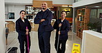 Janitor, team and face with caution sign, hygiene service and wet floor for disinfection. Portrait, safety and warning for risk, cleaner group and maintenance worker for tile polishing and equipment