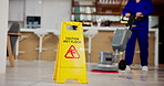 Janitor, person and caution sign with hygiene service, wet floor and disinfection in office. Sanitation, safety and warning for risk, cleaning and cleaner with tile polishing equipment or maintenance