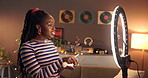 Makeup, influencer and ring light with black woman in home for cosmetics promotion, brand and vlog. Beauty sponsorship, follower engagement and content creator with person and phone for recording