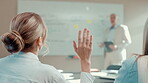 Back, woman and question in presentation for business, opinion and attention with gesture in office. Workshop, team meeting and person with hand raised for employee engagement, voting and pitch ideas