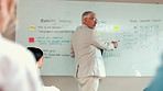 Man, whiteboard and presentation in office for business proposal, marketing strategy and tasks. Mature speaker, employee team and tablet in workplace for meeting, sales graph or information feedback