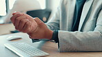 Office, computer and hands of business person with wrist pain, injury and deadline pressure. Closeup, finance or investment banker with burnout, carpal tunnel or ache with sprain hand or joint