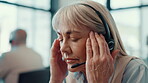 Mature woman, headset and headache at call centre of account error, burnout and sales pressure. Female agent, stress and migraine with tech support problem, customer complaint and brain fog in office