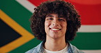 Face, fabric and man with flag for South Africa, confidence and pride with happiness for citizen. Portrait, male person or patriotic with laugh for nationality, country or positive attitude by symbol
