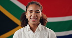 Woman, face and happy with South Africa flag in studio for national pride, confidence and patriot by background. Girl, model and smile in portrait with symbol, respect and sign for loyalty to country