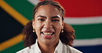 Face, woman and smile with flag for South Africa, confidence and pride with laugh for citizen. Portrait, happy person and patriotic with fabric for nationality, country or positive attitude by symbol