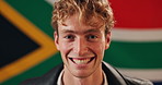 Man, face and happy with South Africa flag in studio for national pride, confidence and patriot by background. Person, model and smile in portrait with symbol, respect and sign for loyalty to country