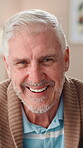 Face, senior man and laughing at house for peace, comedy and funny in lounge. Portrait, smile and elderly person in living room with joke, humor and comfort for retirement wellness of weekend break
