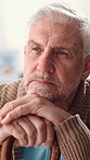 Home, thinking and senior man with nostalgia, sad and mental health with dementia. Pensioner, apartment and elderly person with history, depression and alzheimer with memory, thoughts and retirement