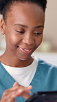 Happy, black woman and nurse with tablet for medical research or schedule at healthcare clinic. Female person, caregiver or health volunteer browsing with smile on technology for telehealth or app